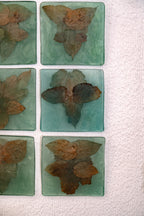 Image showing a set of the ancestral art piece made with resin and pieces of withered leaves
